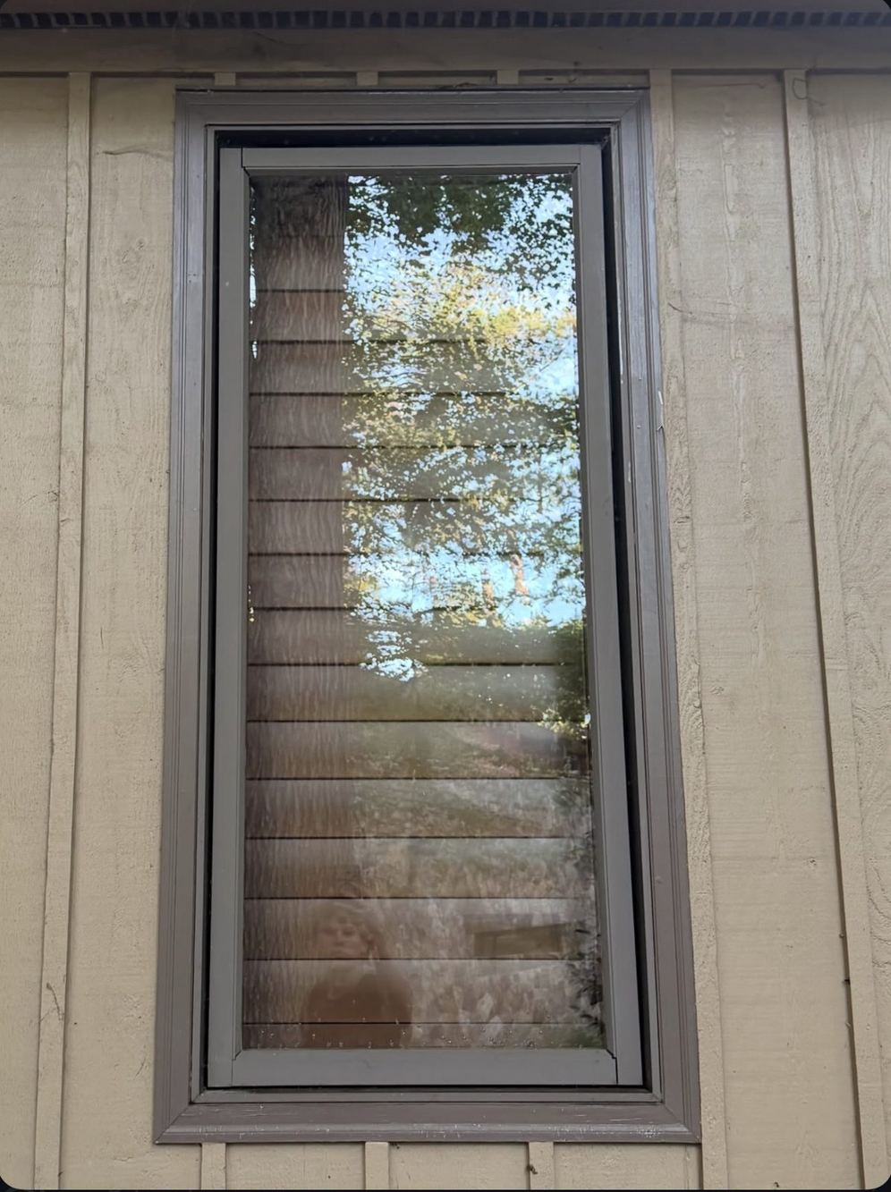 The same window after CrystalPane pure-water cleaning, clear glass and clean frame